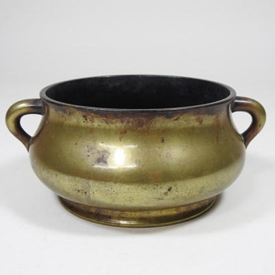 Lot 164 - A small Chinese bronze twin handle censer,...