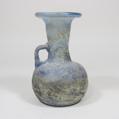 Lot 181 - An iridescent blue glass flask, possibly Roman,...