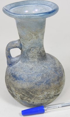 Lot 181 - An iridescent blue glass flask, possibly Roman,...