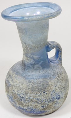 Lot 181 - An iridescent blue glass flask, possibly Roman,...