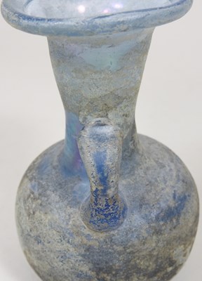 Lot 181 - An iridescent blue glass flask, possibly Roman,...