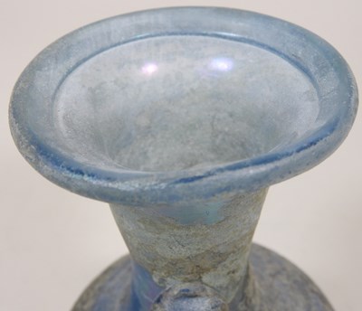 Lot 181 - An iridescent blue glass flask, possibly Roman,...