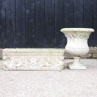 Lot 534 - A cast stone garden trough and urn