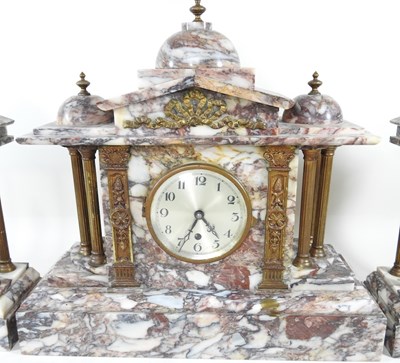 Lot 35 - A clock garniture