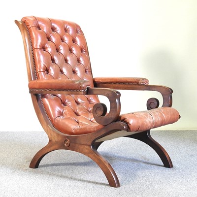 Lot 356 - A leather armchair