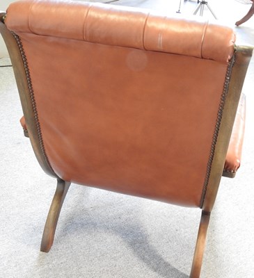 Lot 356 - A leather armchair