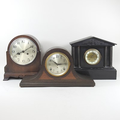 Lot 635 - A black slate mantel clock