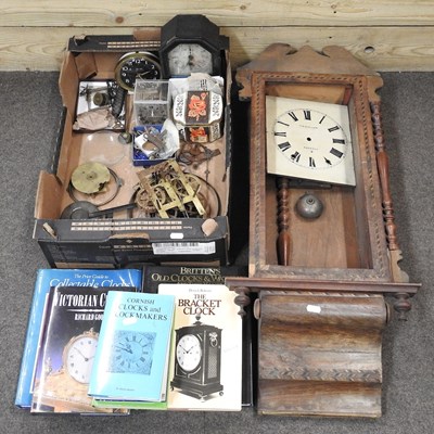 Lot 583 - A collection of clock parts and books