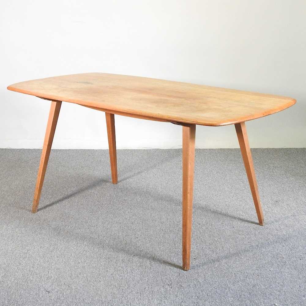 Lot 570 - An Ercol dining table