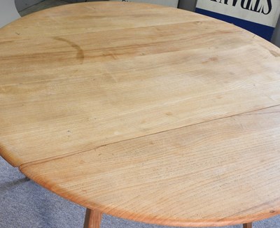 Lot 626 - An Ercol dining table