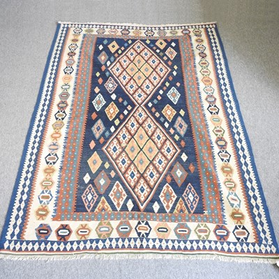 Lot 475 - A Persian kilim rug, with diamond design, on a...