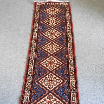 Lot 697 - A Persian runner, with seven central...