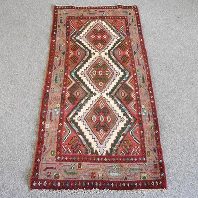 Lot 742 - A Persian rug, with three central medallions,...