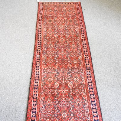 Lot 315 - A Persian runner, with all over designs, on a...