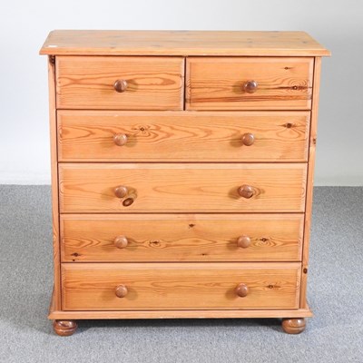 Lot 574 - A modern pine chest of drawers, on turned feet