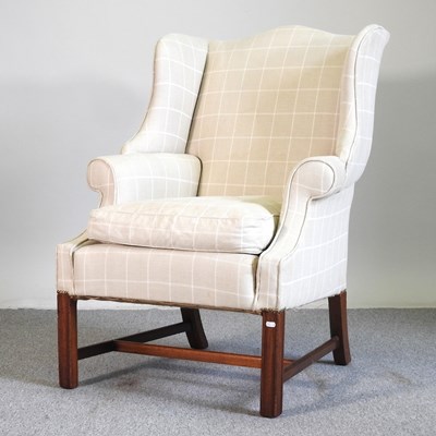 Lot 629 - A wingback armchair