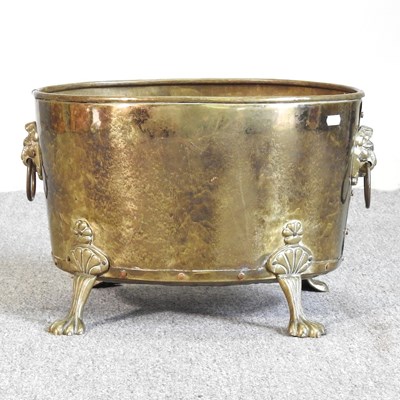 Lot 517 - An oval brass log bin