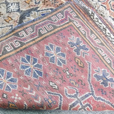 Lot 310 - A Baluchi carpet, with two central lozenges,...