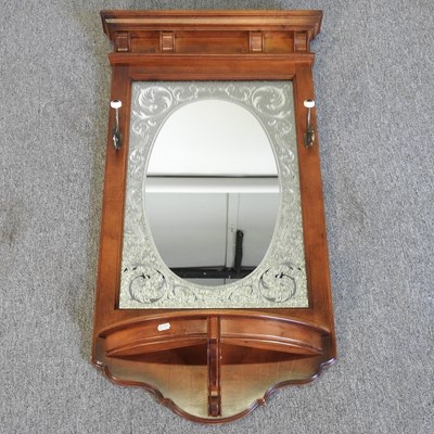 Lot 605 - A mahogany wall mirror