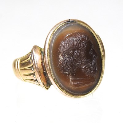 Lot 126 - A large carnelian signet ring, carved with a...