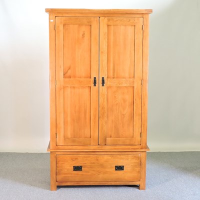 Lot 628 - An oak wardrobe