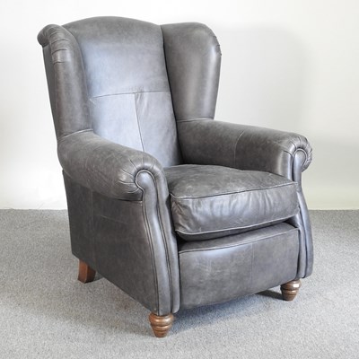 Lot 199 - A grey leather armchair
