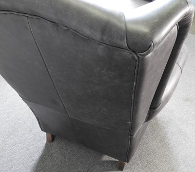 Lot 199 - A grey leather armchair