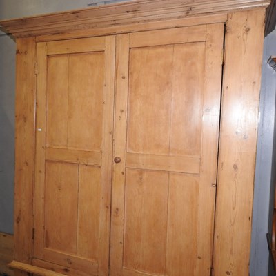 Lot 76 - An antique pine wardrobe