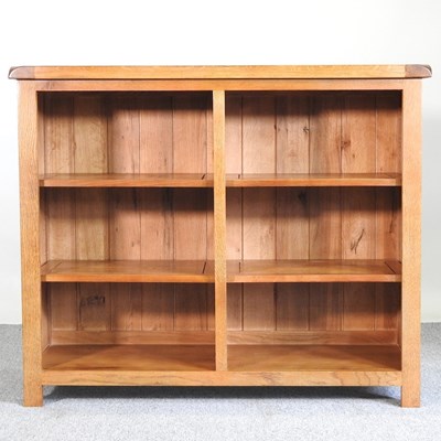 Lot 573 - A light oak bookcase