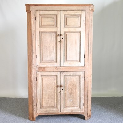 Lot 680 - A 19th century pine standing corner cabinet,...