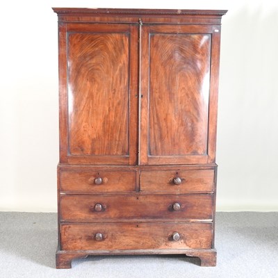 Lot 825 - A George III mahogany linen press, fitted with...