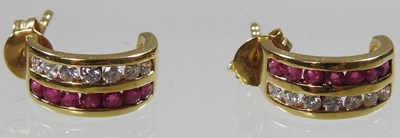 Lot 402 - A pair of 18 carat gold earrings