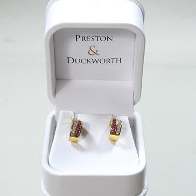 Lot 402 - A pair of 18 carat gold earrings