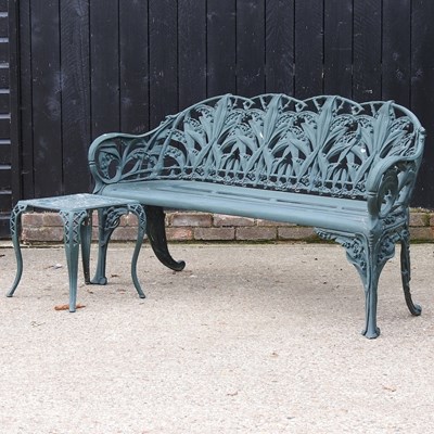 Lot 550 - A garden bench and table