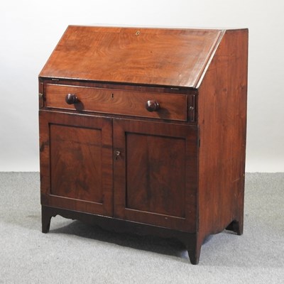 Lot 524 - A 19th century mahogany bureau