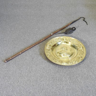 Lot 496 - A large brass charger