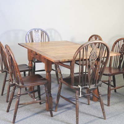 Lot 292 - An oak table and chairs