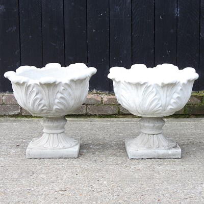 Lot 57 - A pair of stone urns