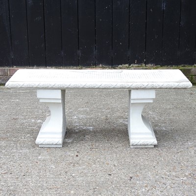 Lot 320 - A reconstituted stone garden bench