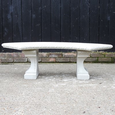 Lot 558 - A cast stone garden bench