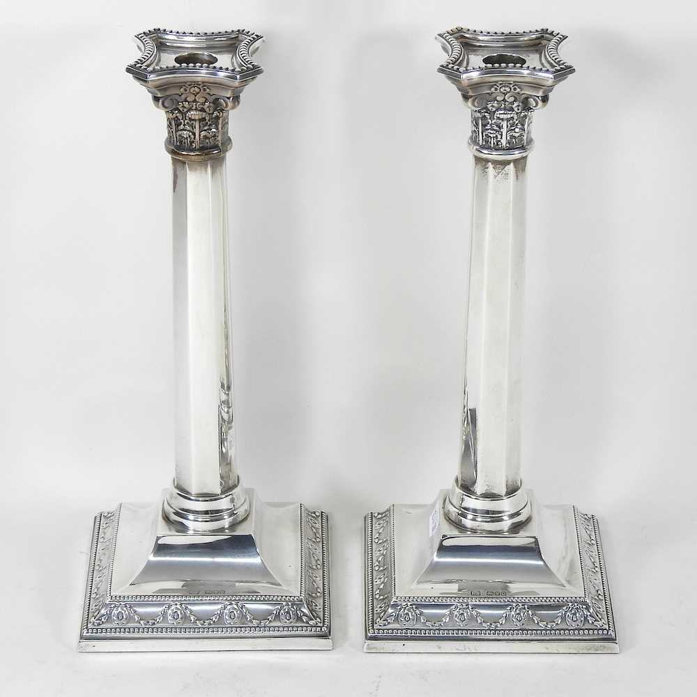 Lot 13 - A pair of silver candlesticks