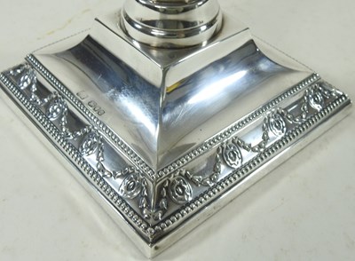 Lot 13 - A pair of silver candlesticks