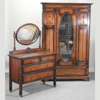 Lot 268 - A 1920's oak Jacobean style single wardrobe