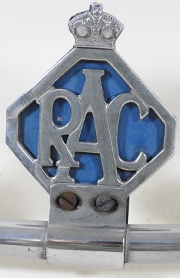 Lot 314 - A vintage car badge bar, displaying four badges