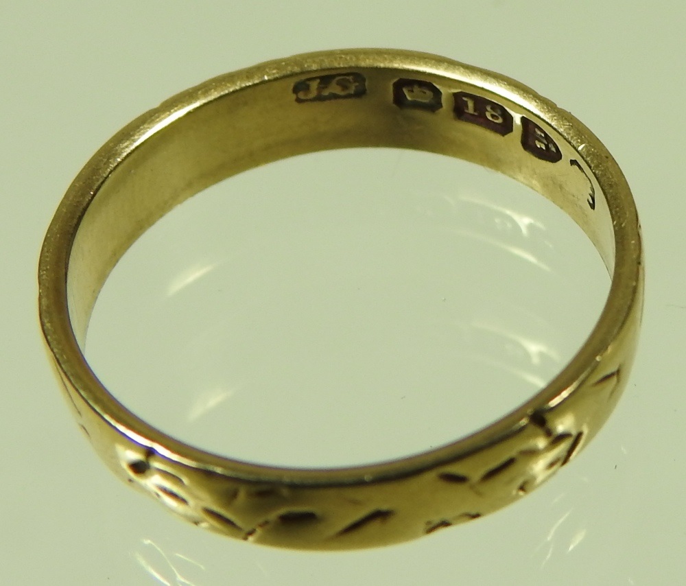 Lot 97 - An 18 carat gold wedding band