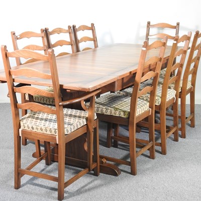 Lot 567 - An Ercol extending dining table, together with...