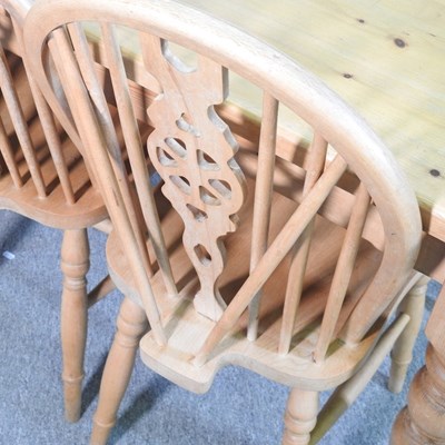 Lot 399 - A pine kitchen table and chairs