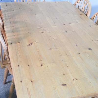 Lot 399 - A pine kitchen table and chairs