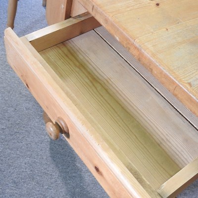 Lot 399 - A pine kitchen table and chairs