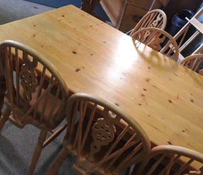 Lot 399 - A pine kitchen table and chairs